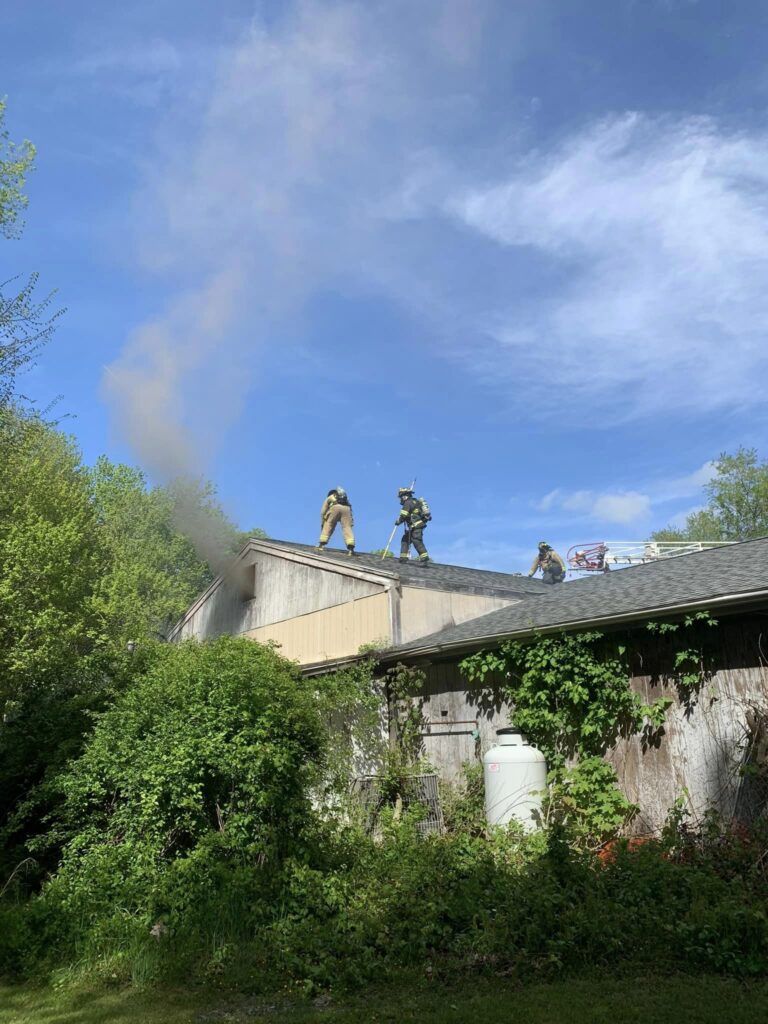 Freetown firefighters responding to a garage fire on May 20, 2024.