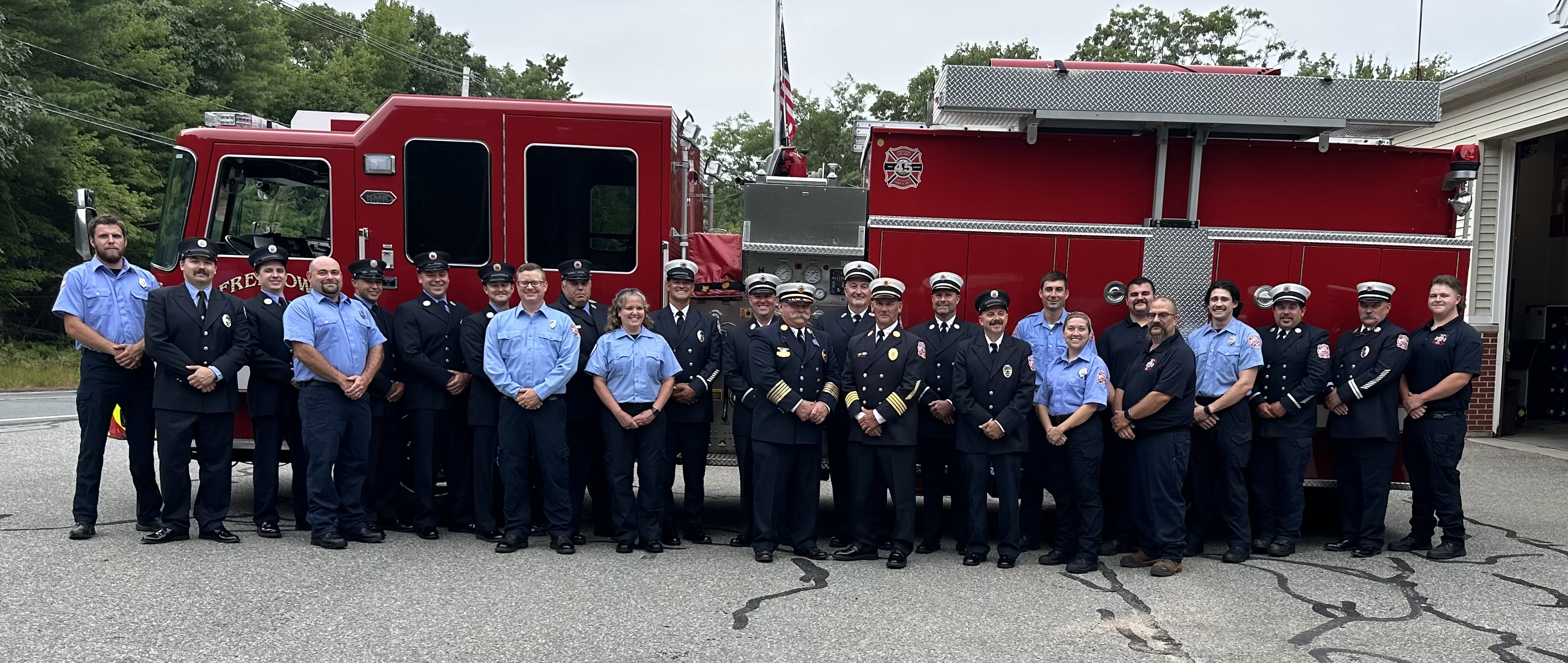 Freetown Firefighters pose for a photo in front of a fire truck.